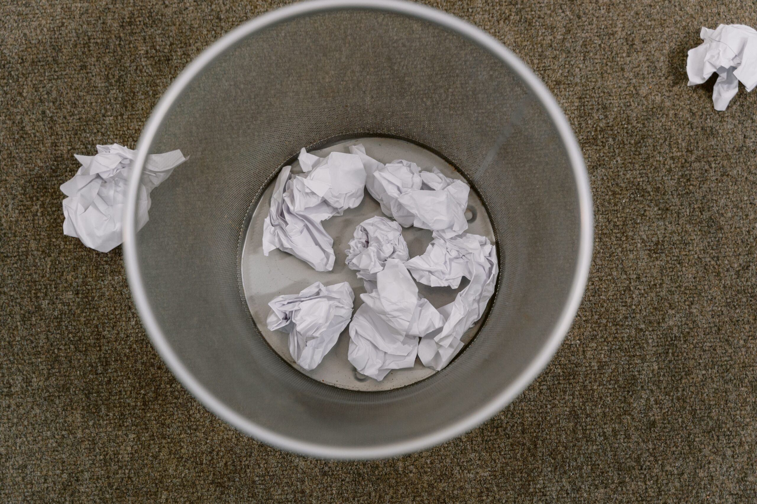 Annual Notice of Change papers in the trash can